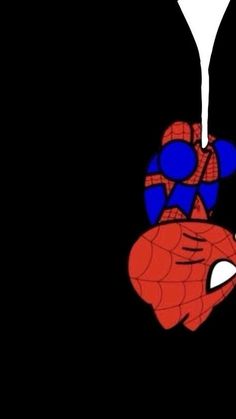 a spider man hanging from the side of a black wall