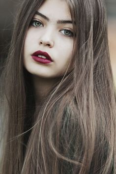 two different pictures with one woman's face and the other has her hair blowing in the wind