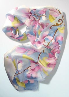 Hand panted silk scarf 'Magnolia Flowers' is a long silk scarves from delicate and light weight, decorated with magnolia flowers on a pastel baby blue skies. Size: about 61 by 17 in (155 by 43 cm) Silk: natural Habotai Light, which is a delicate, semi transparent fabric, with a glossy quality. Silk scarf 'Magnolia Flowers' is made to order! It will take me up to 3 days to paint a similar scarf, please note that I don't use patterns and the scarf for you will be unique and slightly different from Tshirt Tattoo, Pastel Scarf, Silk Painting Techniques, Tattoo Designer, Flowers Pastel, Transparent Fabric, Blue Silk Scarf, Hand Painted Dress, Summer Shawl