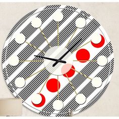 a clock with red and white circles on it