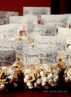 small bags filled with marshmallows sitting on top of a table