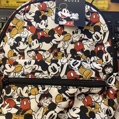 Brand New With Tag "Disney Mickey Mouse" Small Backpack Description: * Adorable Small Disney Mickey Mouse Backpack * Water Resistant And Durable Wipe Clean Polyurathane Material * East West Double Zippers Meet In The Middle For Easy Access * One Outside Zip Storage Pocket * Adjustable Shoulder Straps * Height: 11.5" ~ Width: 9" ~ Depth: 4 Multicolor Disney Bags For Back To School, Multicolor Backpack For Disney Fan Events, Disney Style Bags With Zipper For Back To School, Disney Bags For Daily Use And Back To School, Mickey Mouse Travel Backpack, Disney Back To School Bags With Zipper Closure, Back To School Disney Bags With Zipper, Disney Style Backpack With Zipper Closure, Disney School Bag With Adjustable Strap