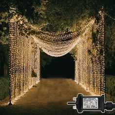 an outdoor lighted archway with lights on it