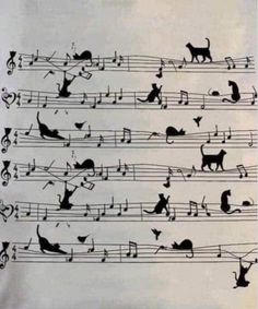 an old sheet music with cats and musical notes on the pages, as well as some cat silhouettes