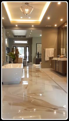 a large bathroom with white marble floors and lights above the bathtub is pictured in this image