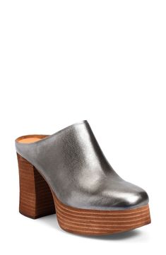 A stacked platform and chunky block heel elevate a rich leather mule set on a cushioned footbed for long-lasting wear. 4" heel; 1 1/2" platform(size 8.5) Cushioned footbed Leather upper/textile lining/rubber sole Imported Formal Platform Clogs With Block Heel, Formal Clogs With Platform Block Heel, Chic Closed Toe Clogs With Chunky Platform, Formal Platform Clogs, Platform Mules With Block Heel In Medium Width, Modern Platform Mules With Block Heel, Chic Block Heel Clogs With Padded Heel, Chic Clogs With Padded Block Heel, Platform Mules With Block Heel