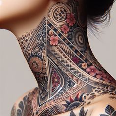 a woman's neck is covered with tattoos and flowers on her body, as well as an intricate design