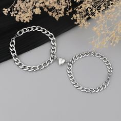 Introducing our Magnetic Stainless Steel Heart Charm Couple Bracelet - a symbol of love and connection. Crafted with precision and elegance, this bracelet is more than just an accessory; it's a reflection of the deep bond between two hearts. Made from high-quality stainless steel, the bracelet is not only durable but also hypoallergenic, making it suitable for everyday wear. The magnetic feature adds a unique touch, bringing the hearts together in a magnetic embrace that signifies the magnetic p Matching Bracelets For Couples Home Made, Couple Gift Bracelet, Cheap Metal Heart Bracelet For Anniversary, Couple Bracelets And Necklaces, Braided Bracelets For Couples, Affordable Black Couples Bracelets, Magnetic Jewelry For Couples, Cheap Couples Style Jewelry For Gifts, Cheap White Heart Bracelet As Gift