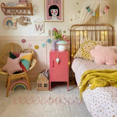 a child's bedroom decorated in pink and gold