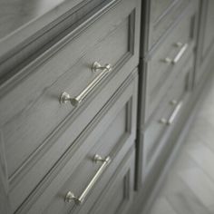 an image of a dresser with handles and knobs