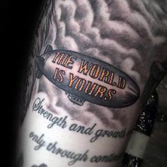 a man with a tattoo on his arm that reads the world is yours, strength and growth only through control