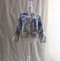 "Vintage Y2K printed denim style jacket Muti-colored print Made by Keren Hart in India 100% cotton Machine wash Button front closure Size M; see measurements below Minor wear throughout Bust: 43 1/2\" Waist: 42\" Sweep: 44 1/4\" Length from high point shoulder: 22 1/4\" Sleeve length (underarm): 16 3/4\" Sleeve opening: 10 3/4\" Mannequin is approximately a current size S/ 4-6. All vintage items are unique and in good condition.  Due to age, previous love, and wear flaws are to be expected.  We Patterned Long Sleeve Cotton Outerwear, Retro Cotton Outerwear For Spring, Printed Cotton Fall Outerwear, Printed Cotton Outerwear For Fall, Multicolor Relaxed Fit Cotton Outerwear, Vintage Printed Outerwear For Spring, Casual Printed Cotton Outerwear, Casual Cotton Printed Outerwear, Retro Cotton Denim Jacket For Spring