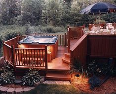 a hot tub sitting on top of a wooden deck