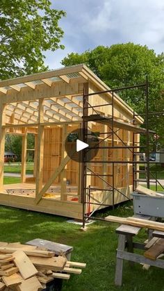 a small wooden building with scaffolding around it