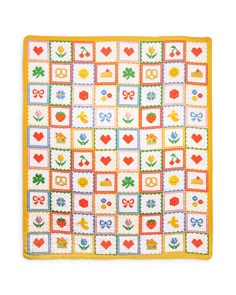 a square quilt with hearts, flowers and other things on the squares is shown in yellow