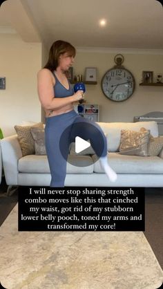 a woman standing in front of a couch with her leg up and holding a water bottle