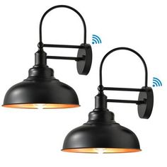 two black wall lights with wifi signals on them