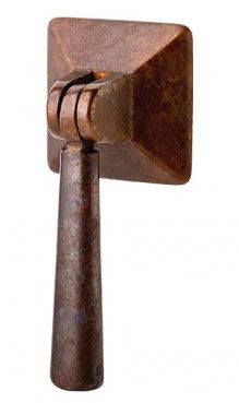 an old fashioned hammer is on display against a white background