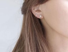 Pearl piercing earrings in two sizes.Unlike a conventional piercing stand, it has a slim bar lineThe item can be worn by those who pierced the earringsComfortable to wear for daily layeringIt is a simple daily item ∙ ∙ ∙ ∙ ∙ ∙ ∙ ∙ ∙ D E T A I L S ∙ ∙ ∙ ∙ ∙ ∙ ∙ ∙ ∙ ∙- MATERIAL: High-Quality Surgical steel  Silver Plated, Pearl Bead- Pearl size : 4mm, 6mm / Ball size 4mm, 4mm∙ ∙ ∙ ∙ ∙ ∙ ∙ ∙ ∙ ∙ P R E P A R A T I O N ∙ A N D ∙ P R O C E S S I N G ∙ T I M E∙ ∙ ∙ ∙ ∙ ∙ ∙ ∙ ∙ ∙ We are excited to now o 3 Hole Ear Piercing Pearl, Pearl Earrings Second Hole, 2 Earrings Piercings Pearl, Pearl Earrings Double Piercing, Pearl Double Piercing, Ear Piercings Pearls, Double Ear Piercing Pearl, Double Ear Piercing Ideas Classy, Pearl Piercing Ears