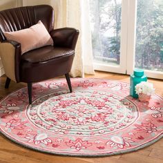 a living room area with a chair and rug