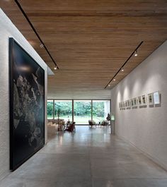 an empty room with paintings on the wall