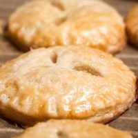 several pastries sitting on top of a wooden table