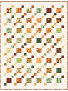 an orange and green quilt with squares in the center, on top of a white background