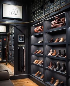 there are many pairs of shoes on the shelves