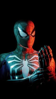 the amazing spider - man is holding his hands up in front of him with glowing eyes