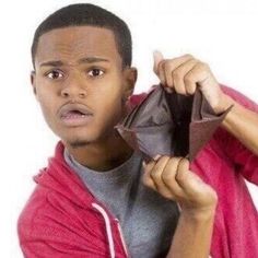 a young man is holding an origami piece