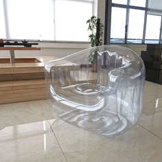 a plastic chair sitting on top of a tiled floor