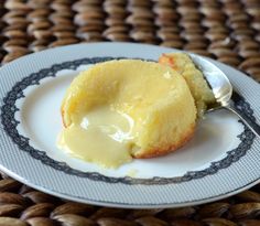 a piece of cake on a plate with a spoon