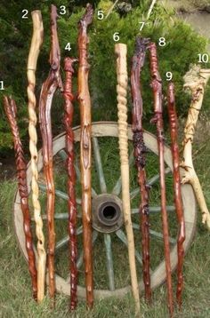 an old wagon wheel with several different types of sticks sticking out of it