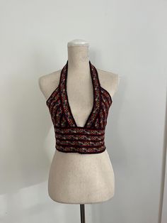 Women's Bralette Black with blue/orange flowers halter, deep v bralette Size small:  Bust: 35" bust (model wears 34B or 36A bra) Waist: 27.5" waist (26" long with extension for buttoning) Halter: 14" deep from shoulder to sternum Festival Halter Top With Built-in Bra, Bohemian Halter Top With Built-in Bra, Spring Festival V-neck Halter Top, Fitted Multicolor V-neck Halter Top, Halter Neck Top With Built-in Bra For Festival, Floral Print Halter Neck Top For Party, Festival Halter Neck Top With Built-in Bra, Red Triangle Halter Top With Built-in Bra, Fitted Floral Print Halter Neck Top