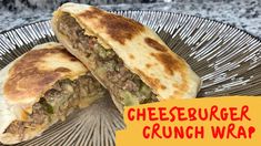 a close up of a sandwich on a plate with the words cheeseburger crunch wrap