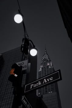 street signs and lights in the city at night