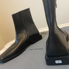 Balenciaga Bb Rim Square Heel Boots 616349. Like Brand New. Only Worn Once. Comes With A Dustbag, But No Box. Size Is 37.5 (Men) European Size / 7 (Men) Us Size Designer Fitted Square Toe Boots, Designer Ankle Boots For Business, Designer Almond Toe Business Boots, Designer Square Toe Office Boots, Designer Boots For Formal Occasions, Designer Formal Boots, Designer Fitted Boots For Business, Square Heel Boots, Shoes Balenciaga