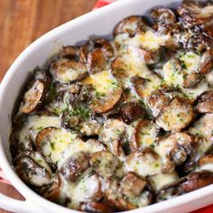 a casserole dish filled with mushrooms and cheese