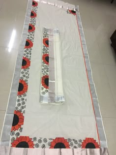 the table runner is laid out on the floor