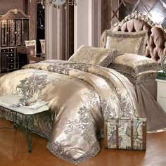 the bed is made with gold comforters and pillows