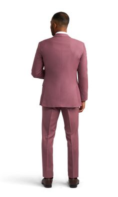 A slim rose pink suit with two buttons and a notch lapel. Tailored Pink Blazer With Hidden Button Closure, Pink Business Blazer With Hidden Button Closure, Pink Blazer With Notch Lapel And Hidden Buttons, Pink Notch Lapel Blazer With Hidden Button Closure, Classic Pink Blazer With Hidden Button Closure, Classic Pink Blazer With Hidden Buttons, Pink Single Breasted Blazer With Notch Lapel, Pink Single-breasted Blazer With Notch Lapel, Classic Pink Blazer With Double Button Closure