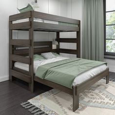 a bunk bed sitting on top of a hard wood floor next to a large window