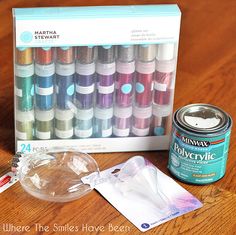 the contents of a craft kit including glue, paper and scissors on a wooden table