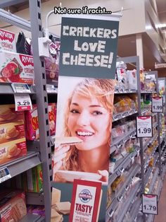 a sign in a grocery store that says crackers love cheese umm, we prefer the term saline american and yes we do love cheese