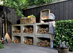 the back yard is filled with firewood and gardening tools