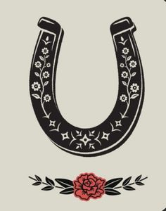 the letter u is decorated with flowers and an old - fashioned horse shoe on it