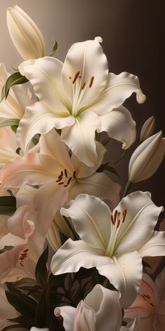 white lilies and other flowers in a vase