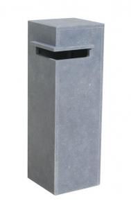 a grey trash can sitting next to a white wall