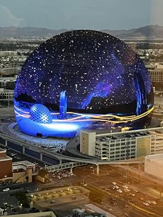 an aerial view of a large building in the middle of a city with stars on it