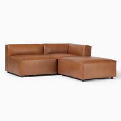 a brown leather sectional sofa sitting on top of a white floor next to an ottoman